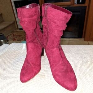 A pair of Kaari Blues Kensie burgundy booties in a ladies size 8.5.